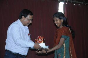 Renuka receiving her certificate