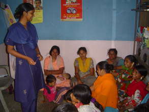 A girl leader educating women