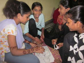Girls learning about body parts in health workshop