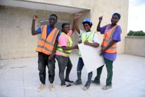 Ayisha with her tile-laying crew in Tamale, Ghana