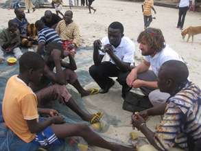 interviewing children mending fishing nets