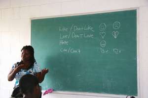 Lynda, one of the Haitian teachers, leads class