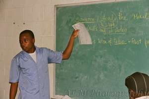One of the Haitian teachers teaching