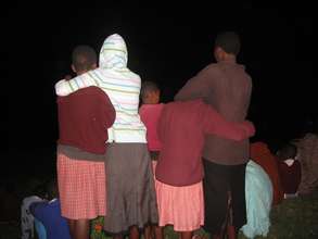 Counselors with their girls in the evening