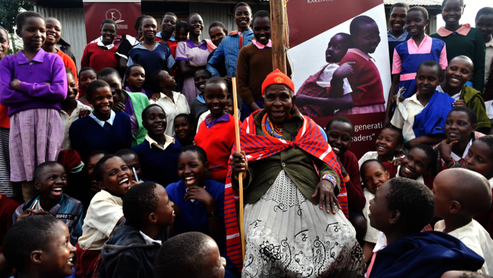 A Maasai Elder Visiting With Students