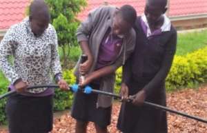 Girls working on automatic irrigation system