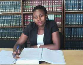 Sarah in the library at school
