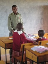 David instructing 5th grade students in English