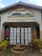 Delivering COVID supplies to partner schools.