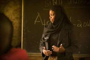 Chiku speaks at a Parent Engagement Meeting