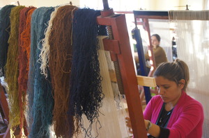 A Young Woman in Van Weaves at a Kilim