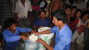 Giving rice to flood victims