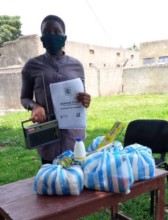 Daphine receives food aid and learning resources