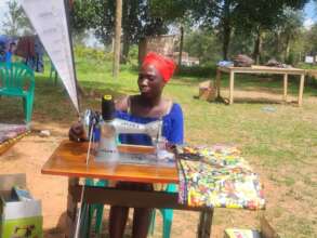 Zakia testing her new sewing machine
