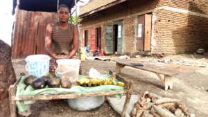 Moreen has set up a fruit and vegetable stall