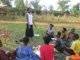 Namukose teaching young women in her community