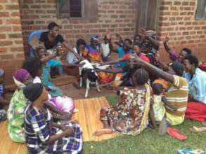 Women's group excitement upon receiving their goat