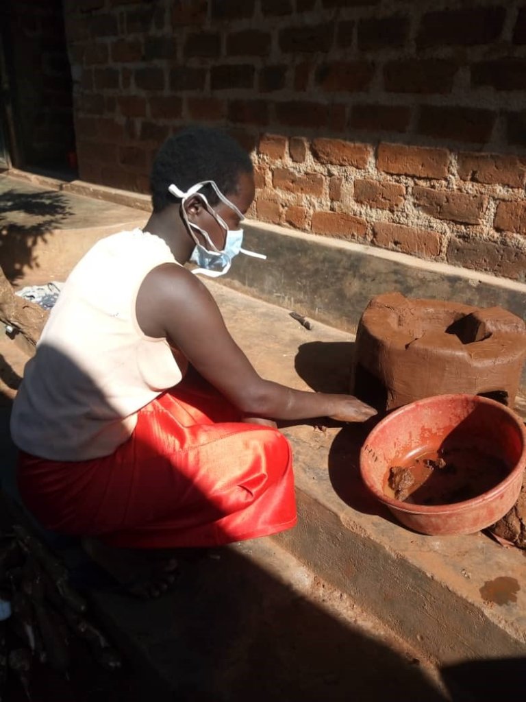 Viola making a cooking stove to sell