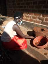 Viola making a cooking stove to sell