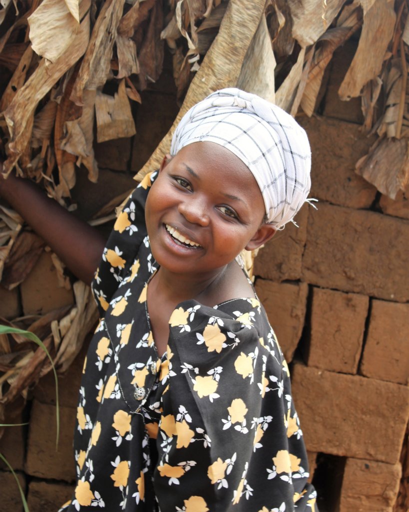 Young woman shows off the bricks she has for sale