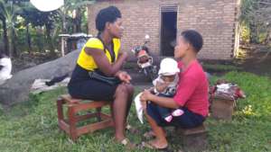 Adolescent mother receives support from mentor.