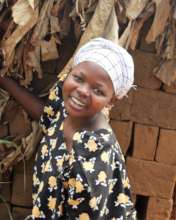 Young woman shows off the bricks she has for sale