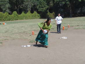 Julia flying with the rugby ball.