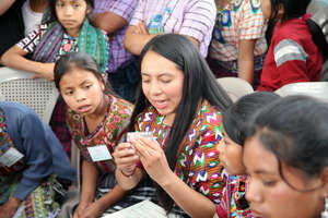 Mentor teaching girls about reproductive health