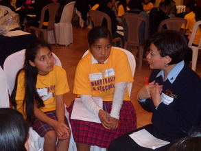 Bank manager tells girls about her job.