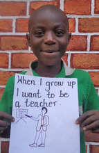 Rogers with his drawing of himself as a teacher