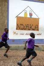 Nyaka student running and playing on campus.