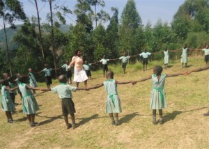 Abia and her nursery class playing outside