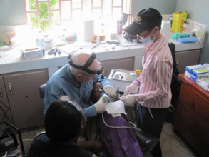 Dental volunteer providing care