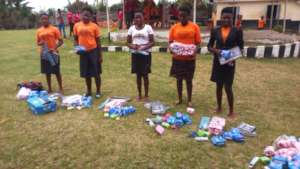 Students opening packs of their school supplies