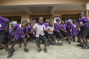 Primary students dancing at the celebration