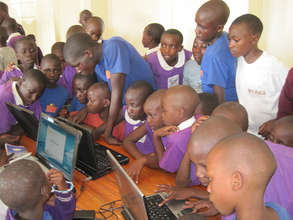 Students learning computer skills in new lab