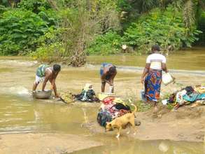Washing of Clothes in Aponmu River