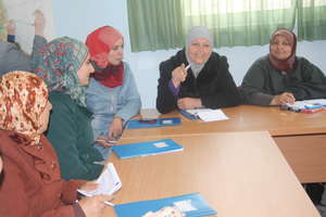 Entrepreneur Amna leads a discussion in a seminar
