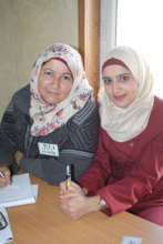 Entrepreneurs Dalal and Asmaa' smile at a training