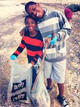 Two siblings taking part in a beach clean-up!