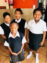 Primary school girls beaming with pride!