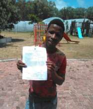 Our oldest boy beaming with his matric certificate