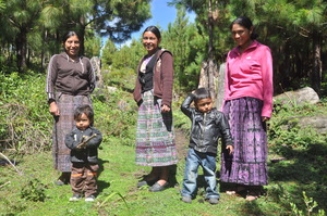 Mothers smiling with their sons in Guatemala.