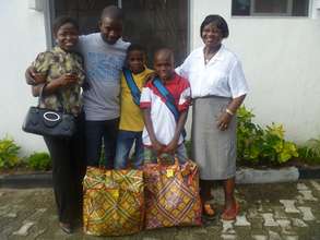 Two boys packed with provisions to go home