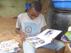 A boy appreciates his photo-album