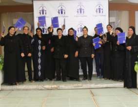 Widows receive their B'edaya microfinance loans.