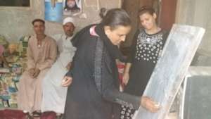 Maria teaching adult literacy classes