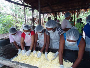 Women processing manioc in Para, Brazil