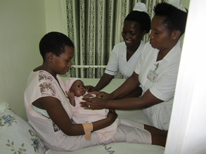 Midwives assisting a mother