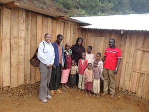 Childline Kenya staff with Mukami's family
